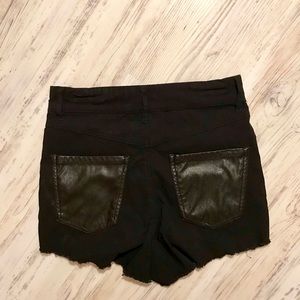 Shorty shorts w/ faux leather back pockets